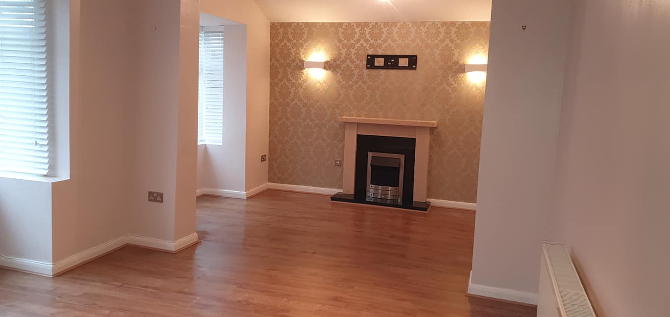 After tenancy cleaning, empty clean living room by Bright Star Cleaning and Maintenance Services